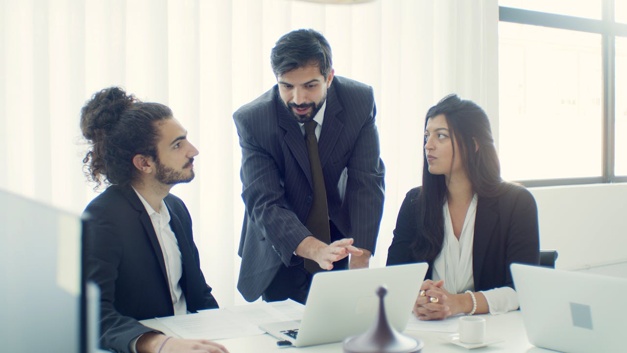 Mastering the First Impression: Your intriguing post title goes here Professional team in office discussing a business project with focused collaboration.